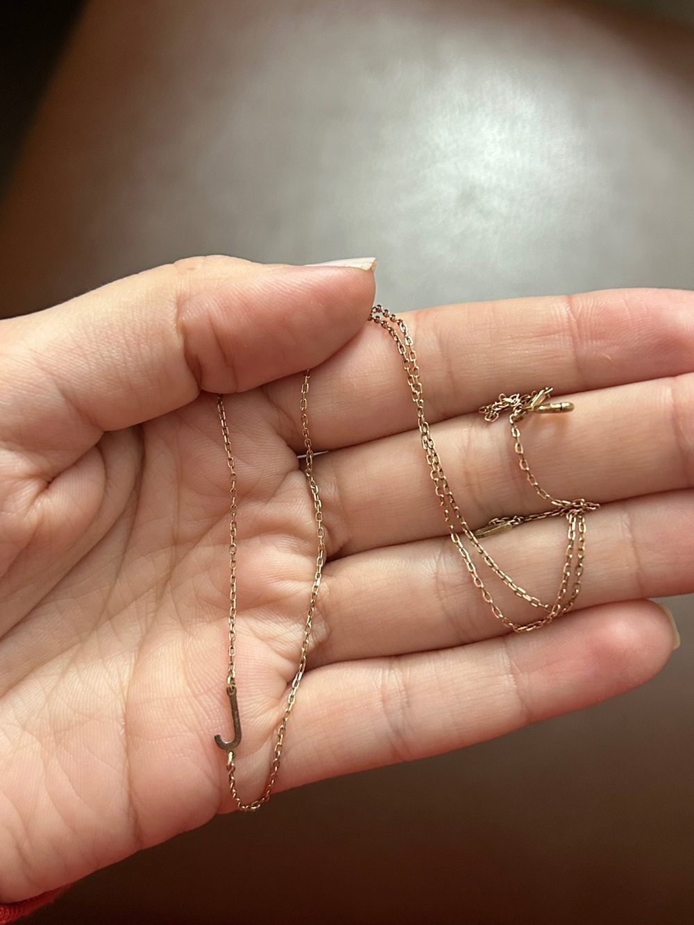 Gold colored J necklace from Etsy